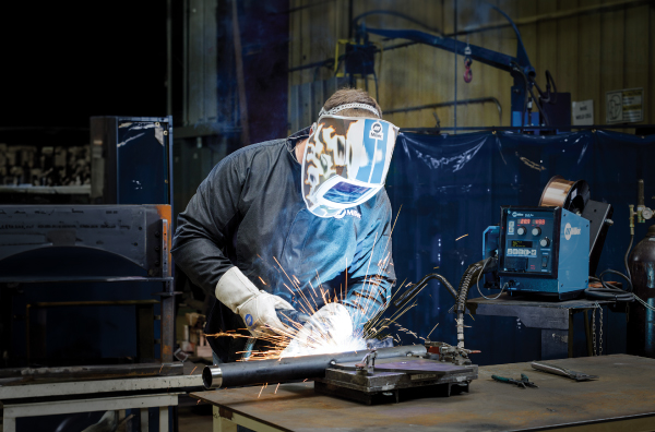 welder welding a piece of metal